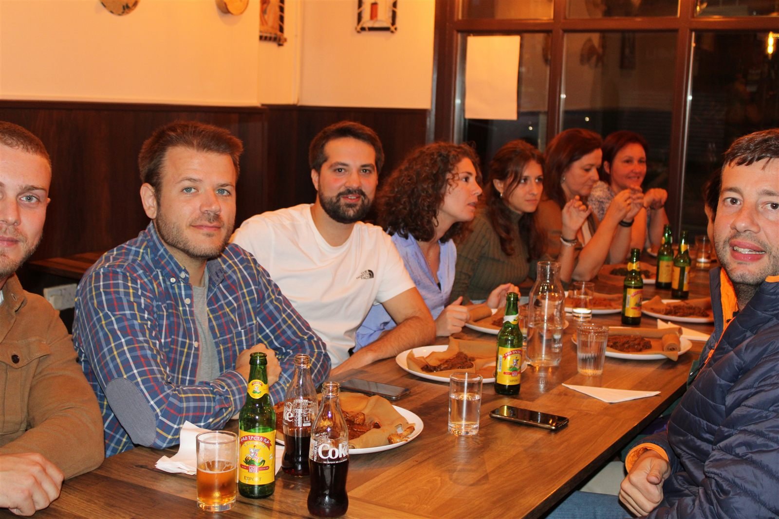 Friends dining together at Asmara Bella