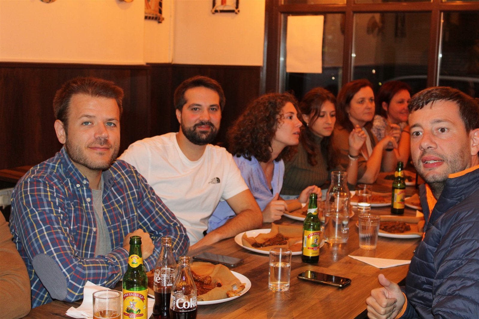 Guests sharing a meal at Asmara Bella